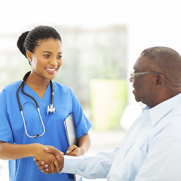 Our Policies - Nurse greeting patient